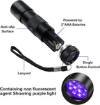 Handheld ultraviolet flashlight revealing hidden stains on a home carpet surface.