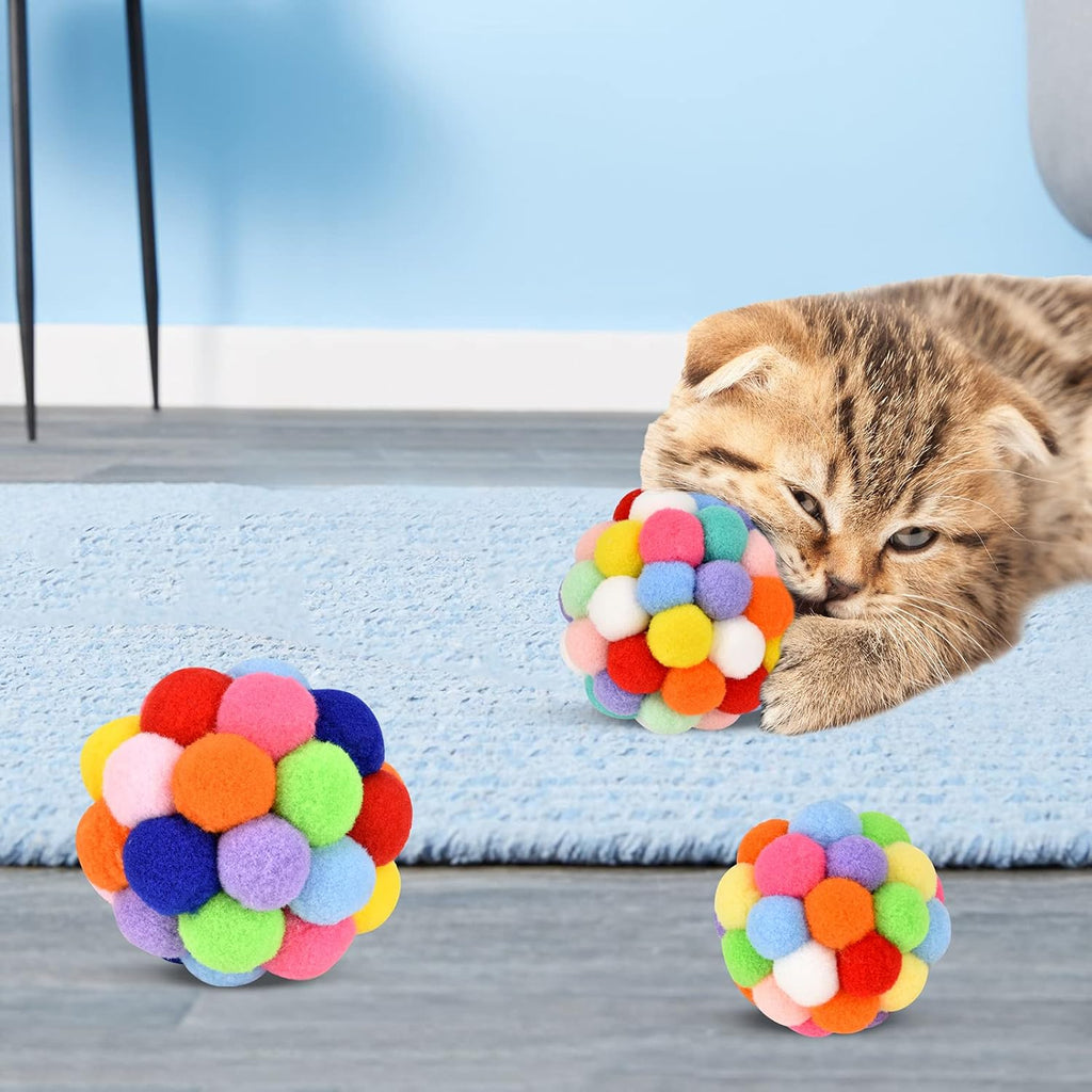 Multi-colored soft pom-pom cat balls designed for biting, chewing, and chasing.