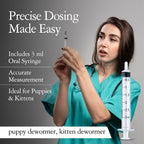 Measuring syringe and bottle of vanilla flavored oral pet dewormer for easy administration.