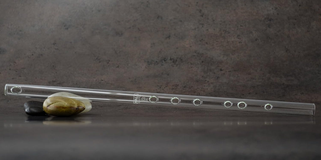 Side profile view displaying the elegant Boehm taper construction of the glass instrument