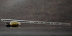 Side profile view displaying the elegant Boehm taper construction of the glass instrument