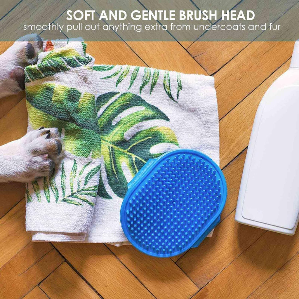 Cleaning a silicone pet brush under running water to remove hair.