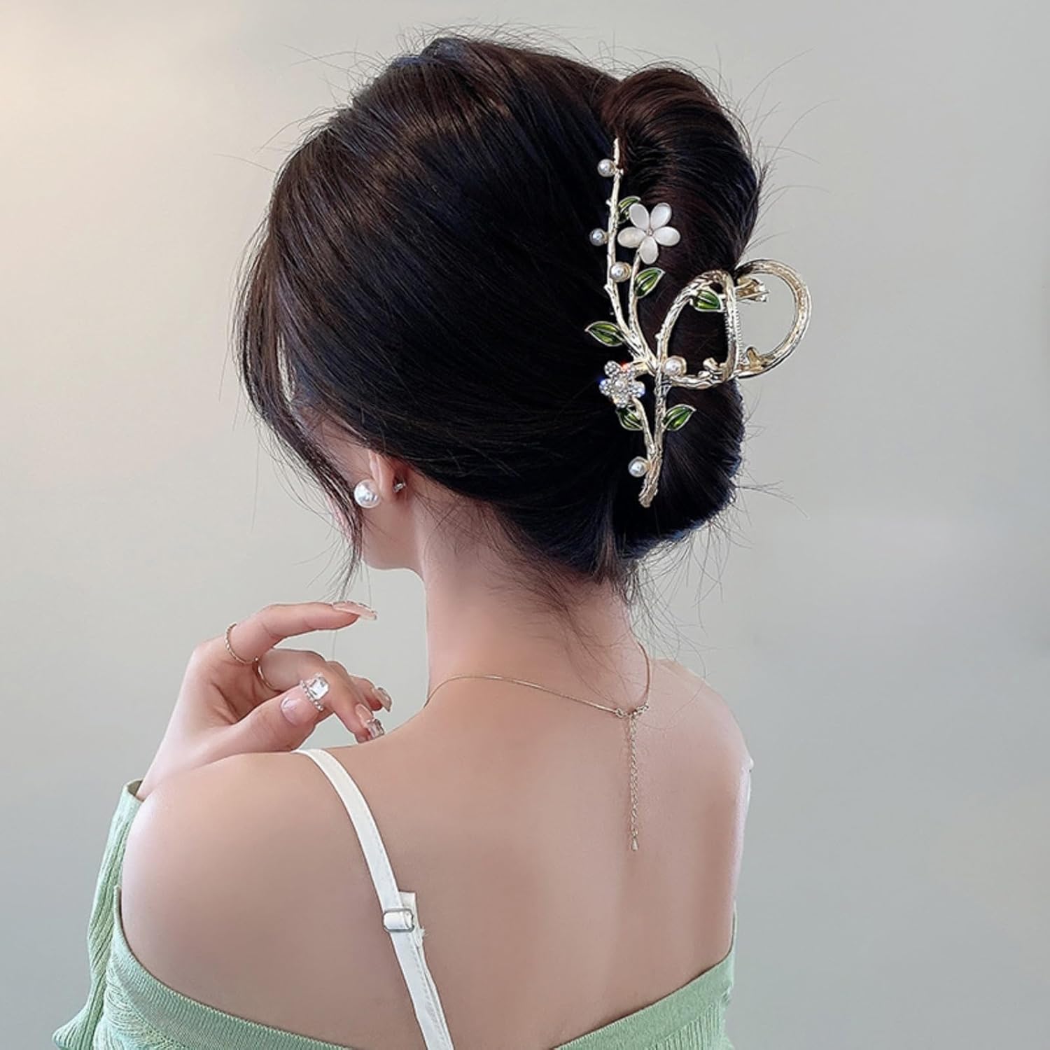 Oh Soo Pink Floral Hair Claw Clip front view showing white petals and green leaves