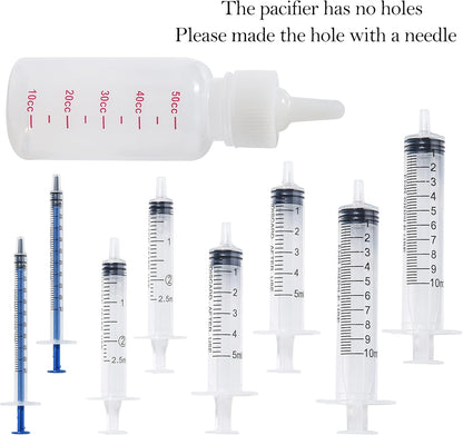 Doggiema professional puppy and kitten tube feeding kit components organized on a flat surface.