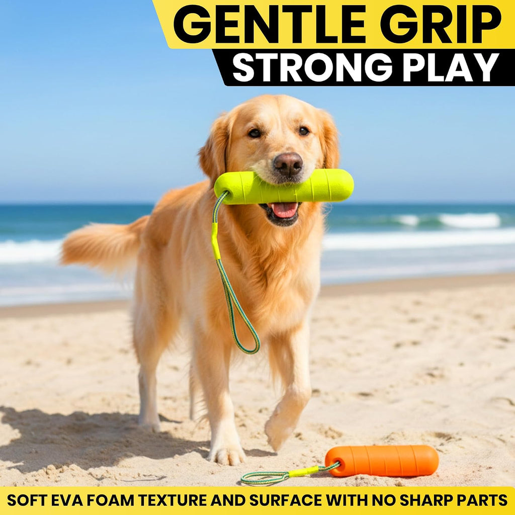 High visibility orange Ruffify dog bumper stick lying on the beach sand.