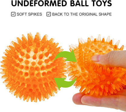Small puppy playing with durable TPR rubber squeaky balls