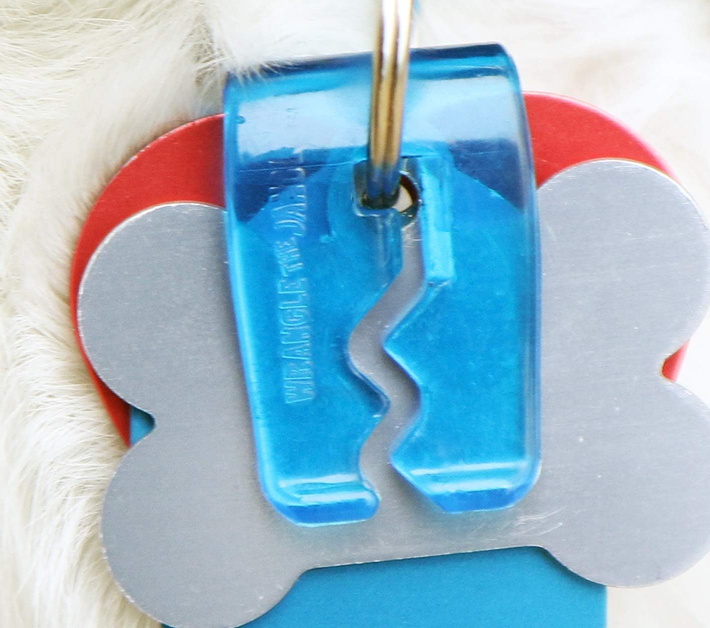 Quiet spot clear pet identity tag organizer and silencer mechanism