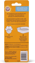 Underneath view of the adhesive backing on the Arm and Hammer cat litter deodorizer capsule.