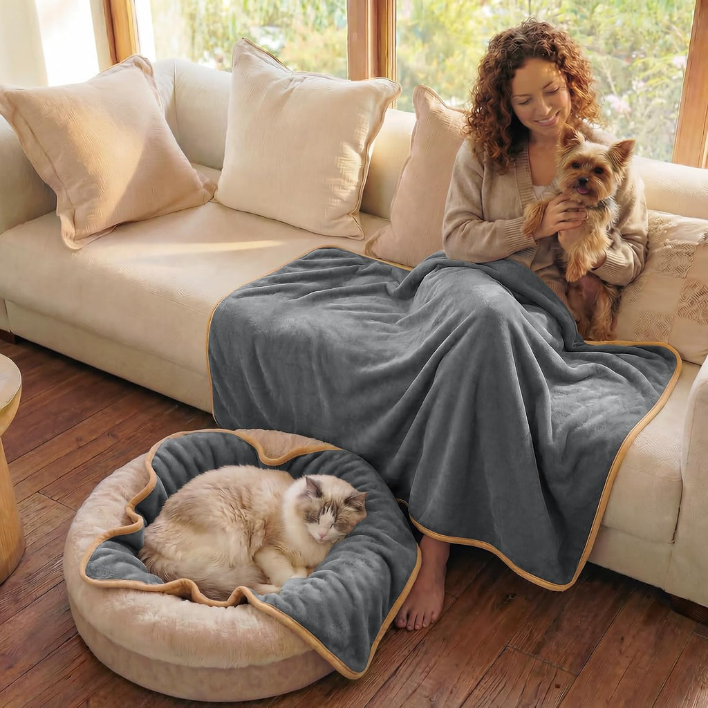 Close-up of the triple-layer fabric texture on the grey pet blanket.