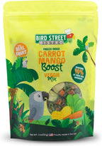 Small parrot eating freeze dried vegetable mix from a feeder