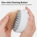 Hand holding Aumuca Jellyfish pet grooming tool