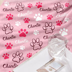 Small puppy snuggling comfortably under the GlisterGlow personalized flannel blanket