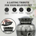 Close up of paw print engraving on slate gray urn