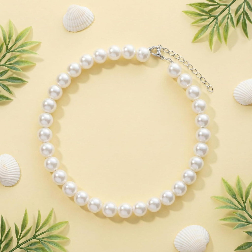 Fengek domestic cat wearing elegant ten millimeter faux pearl costume accessory.