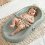 Mallify Baby Changing Pad front view showing the green waterproof surface and adjustable safety strap.