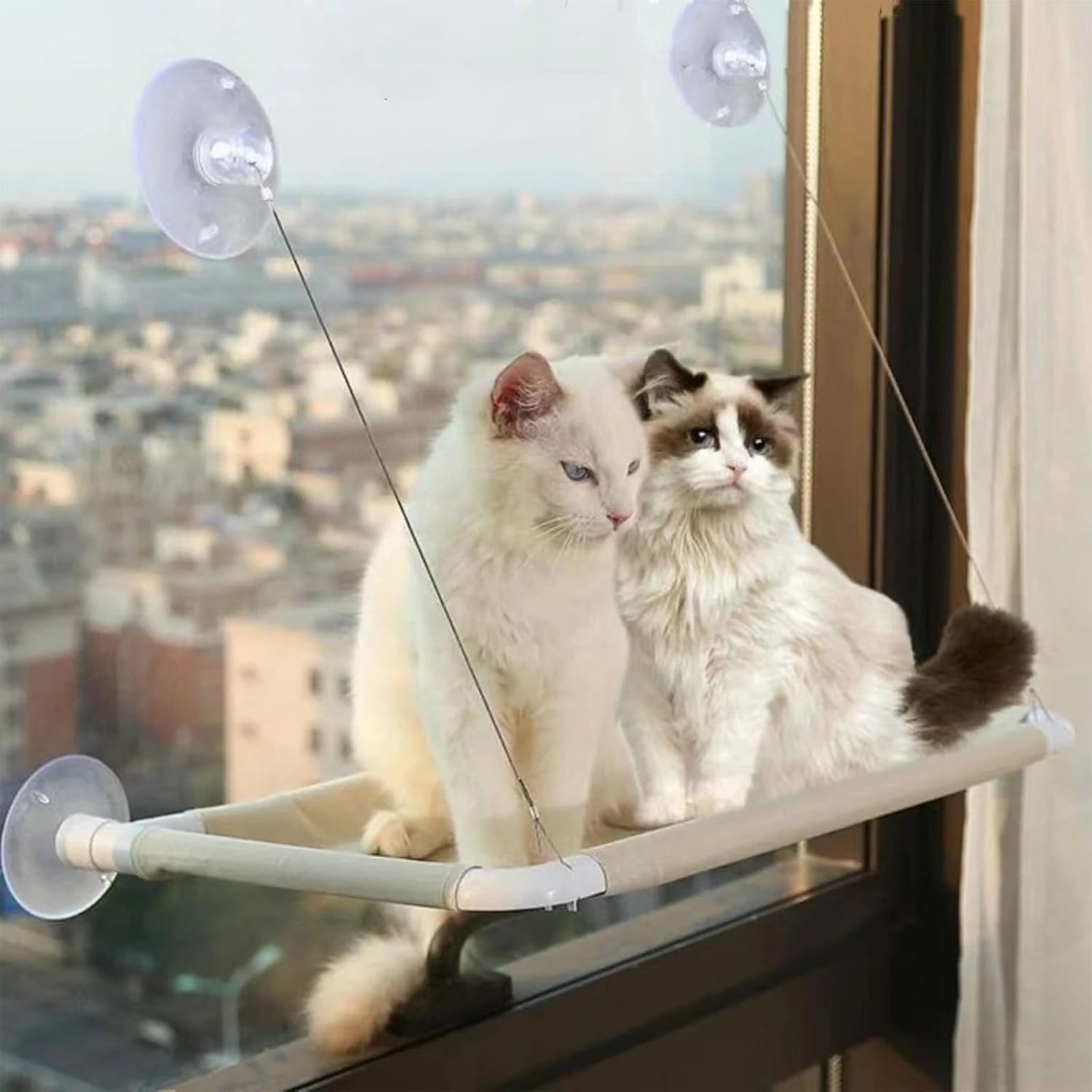 Side angle view of the khaki indoor cat window bed showing the heavy duty suction cups and steel support wires.