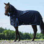Horze 150g fill horse rug with attached neck cover on a horse outdoors