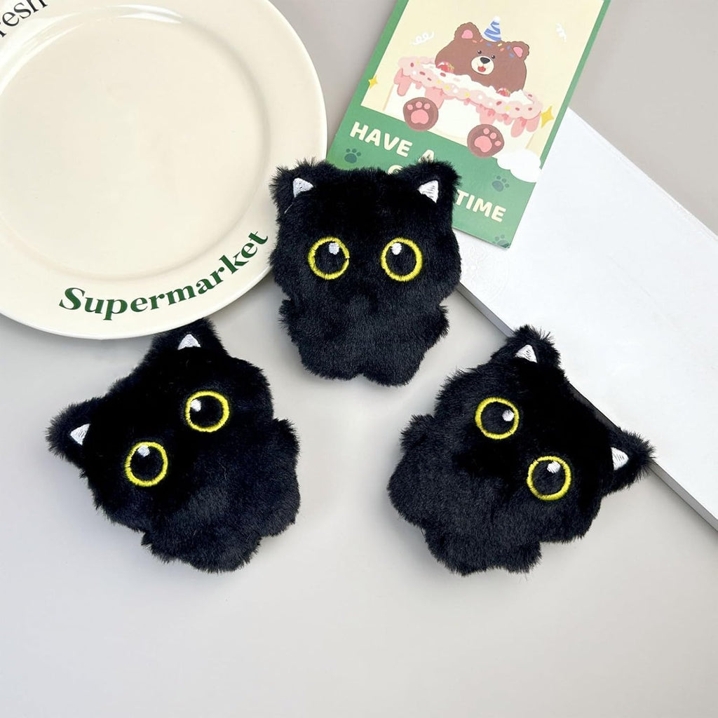 Three squeaky plush black cat toys for indoor cat mental stimulation