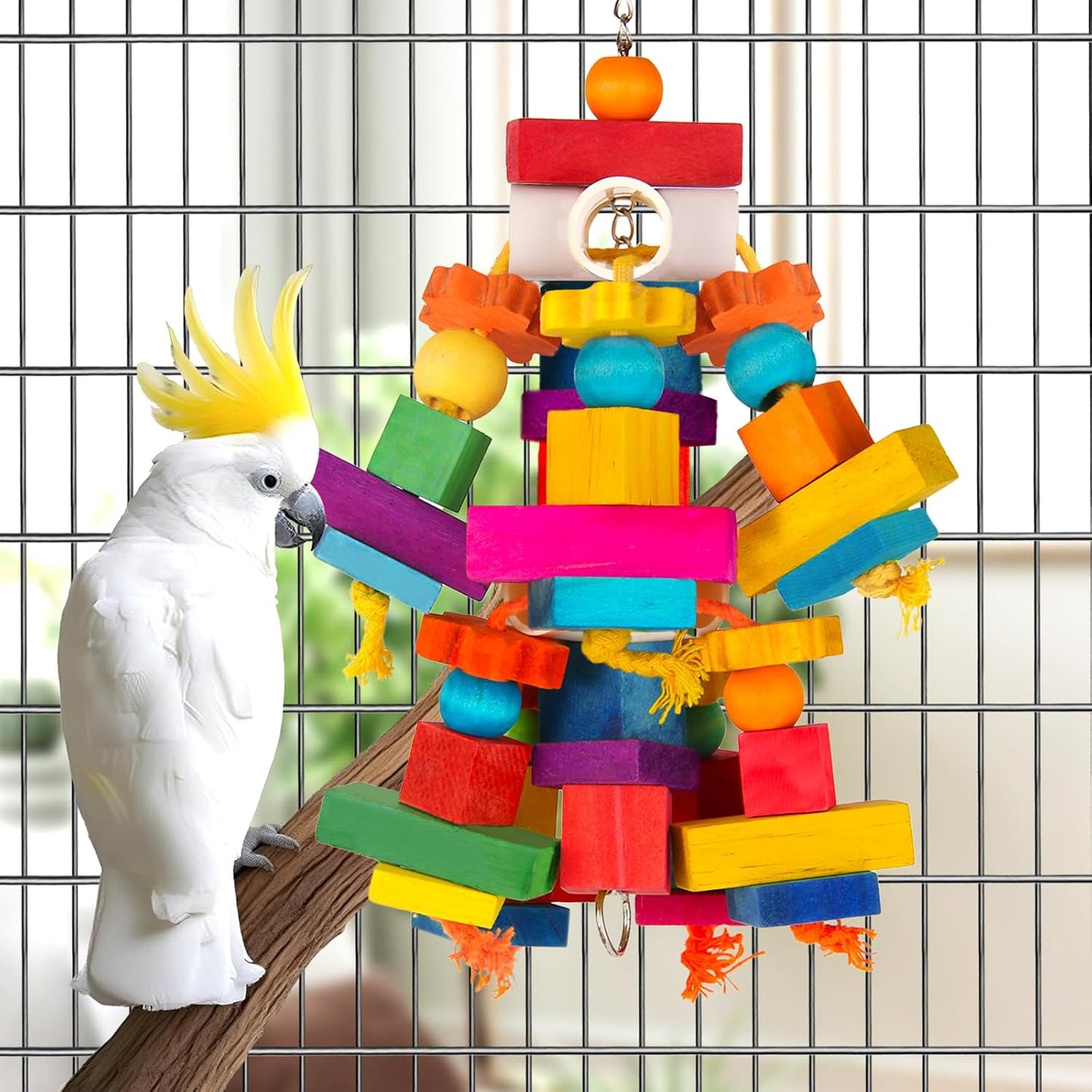 Kyouki multicolored parrot chewing toy securely hanging inside a bird cage.