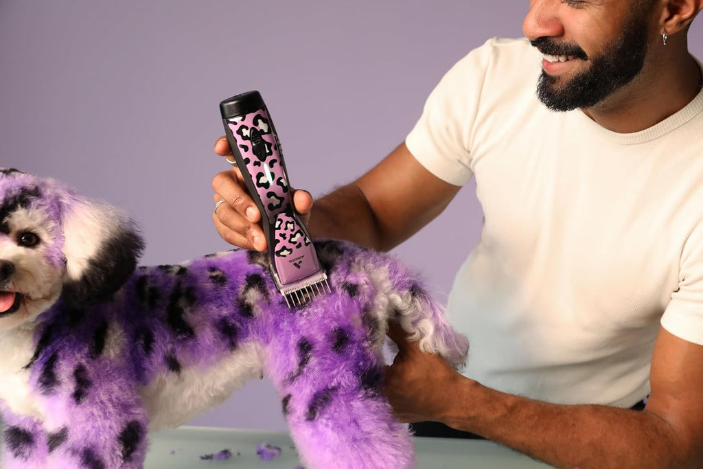 Andis cordless five speed pet clipper showing the removable lithium ion battery base.