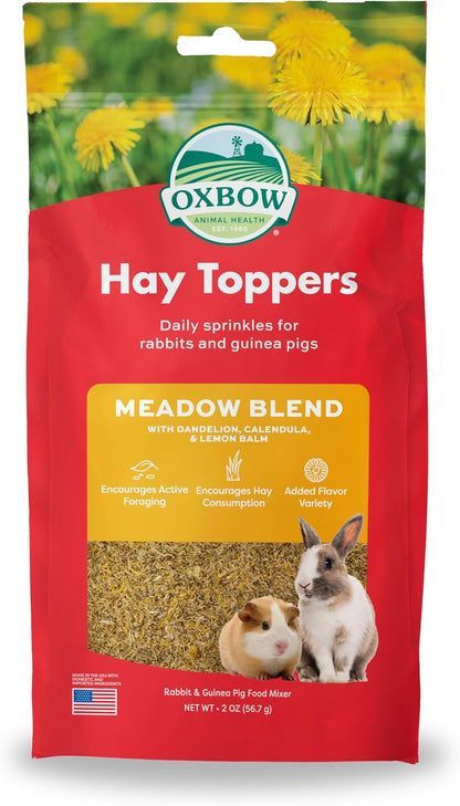 Oxbow Garden Blend treat mix poured out next to its original two ounce packaging container