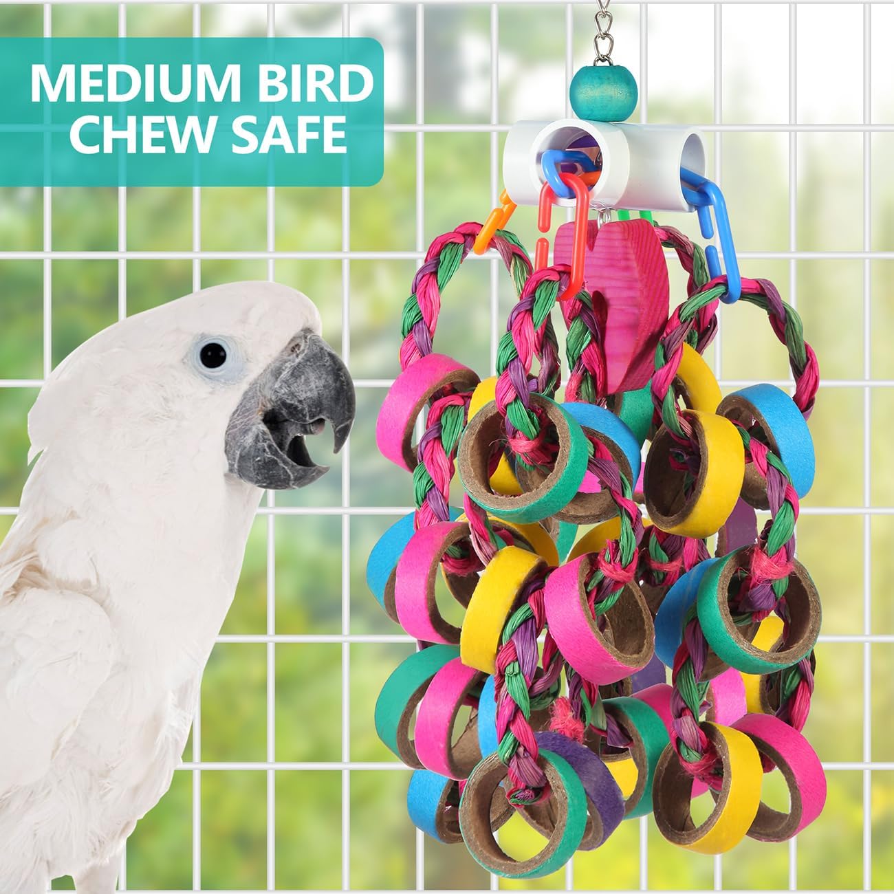 Colorful compressed cardboard bagels on parrot chew toy close up.