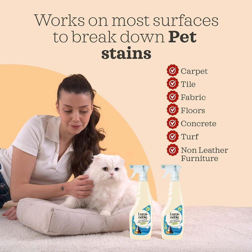 Eco-friendly vegan dog urine cleaner spray on living room fabric upholstery.
