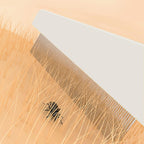 Detailed view of stainless steel pins on Kopal pet comb