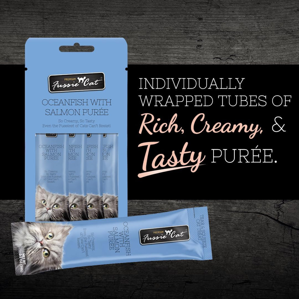 Fussie Cat lickable cat treat tube in hand