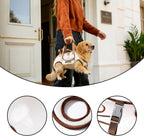 Pet owner using hands-free dog sling carrier during a walk