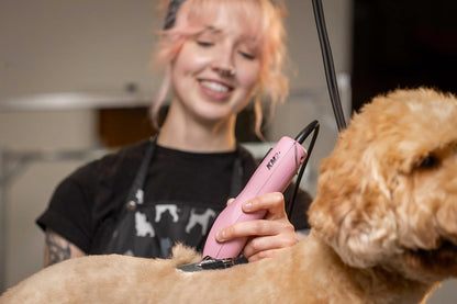 Back view of the pink Wahl professional animal clipper illustrating the speed selection switch