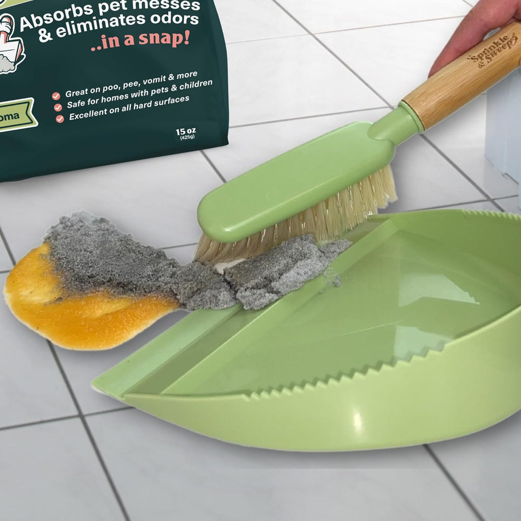 Sweeping solidified dog poop and vomit clumps into dustpan using non toxic cleaning powder
