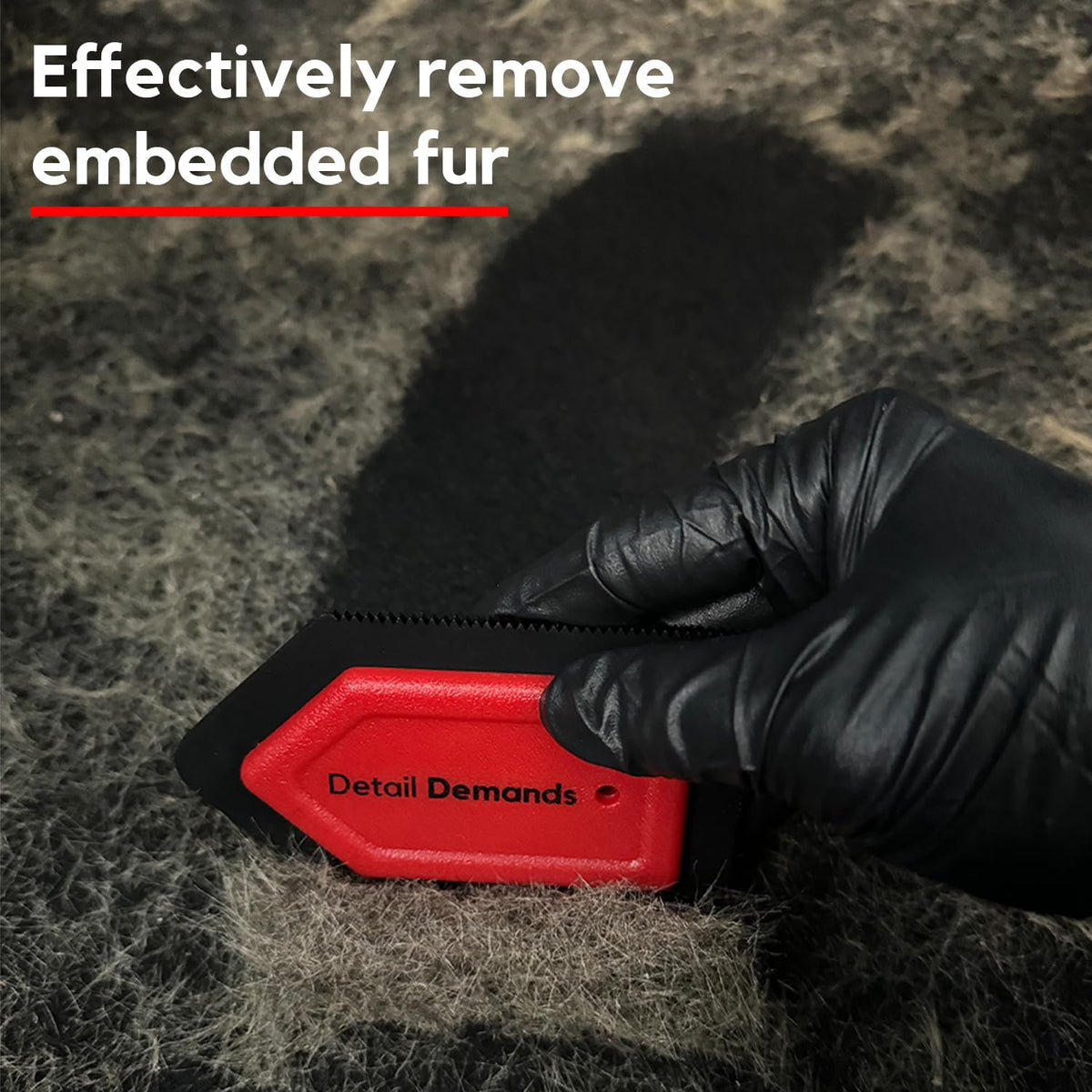 Close up of red rubber edges on Detail Demands pet hair tool