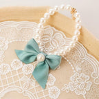 Detailed view of the premium resin faux pearls on the REBABA pet accessory neck locket.