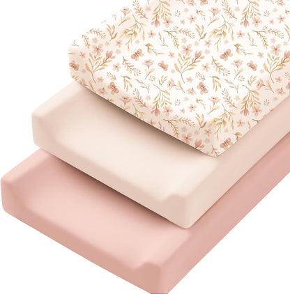 Konssy stretchy changing pad covers front view of three pack in pink spring floral patterns