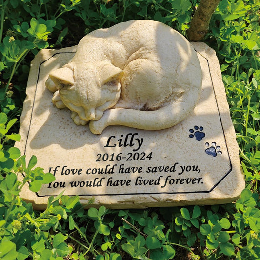 Custom cat headstone for grave garden decor with engraved paw prints.