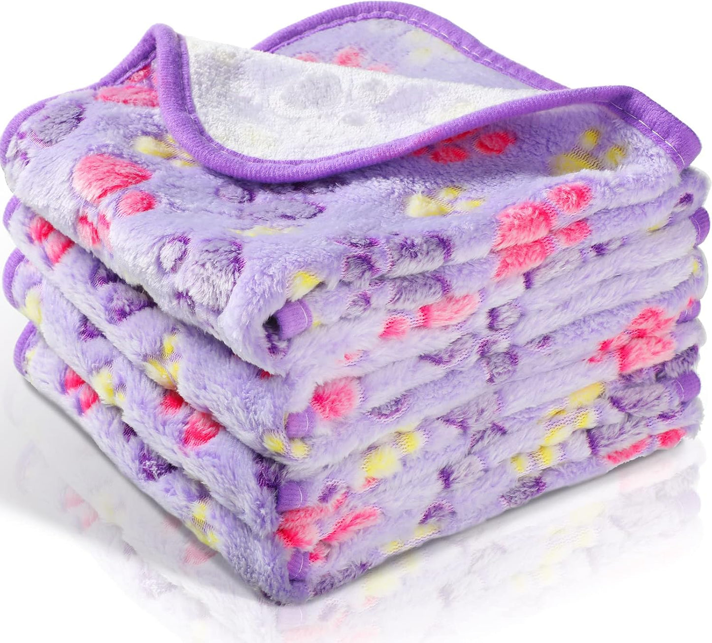 Flannel style pet bedding used as a protective cover on a living room sofa.