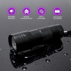 Waterproof IPX4 blacklight flashlight being exposed to water splashes during testing.