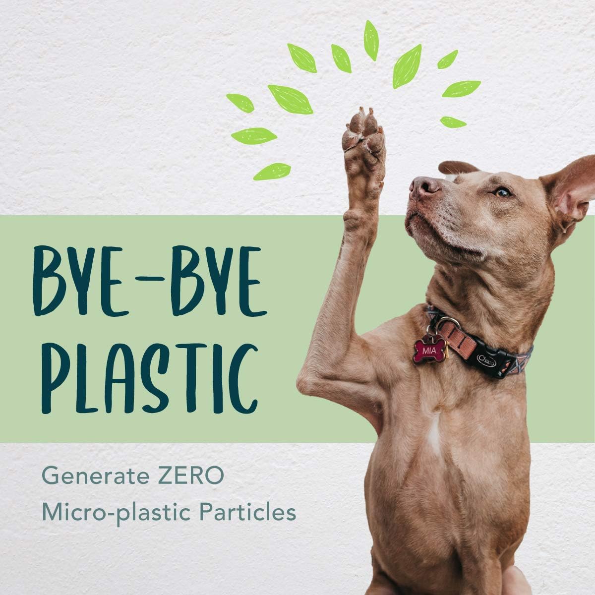 Moonygreen eco friendly dog poop bag rolls next to recycled paper core.