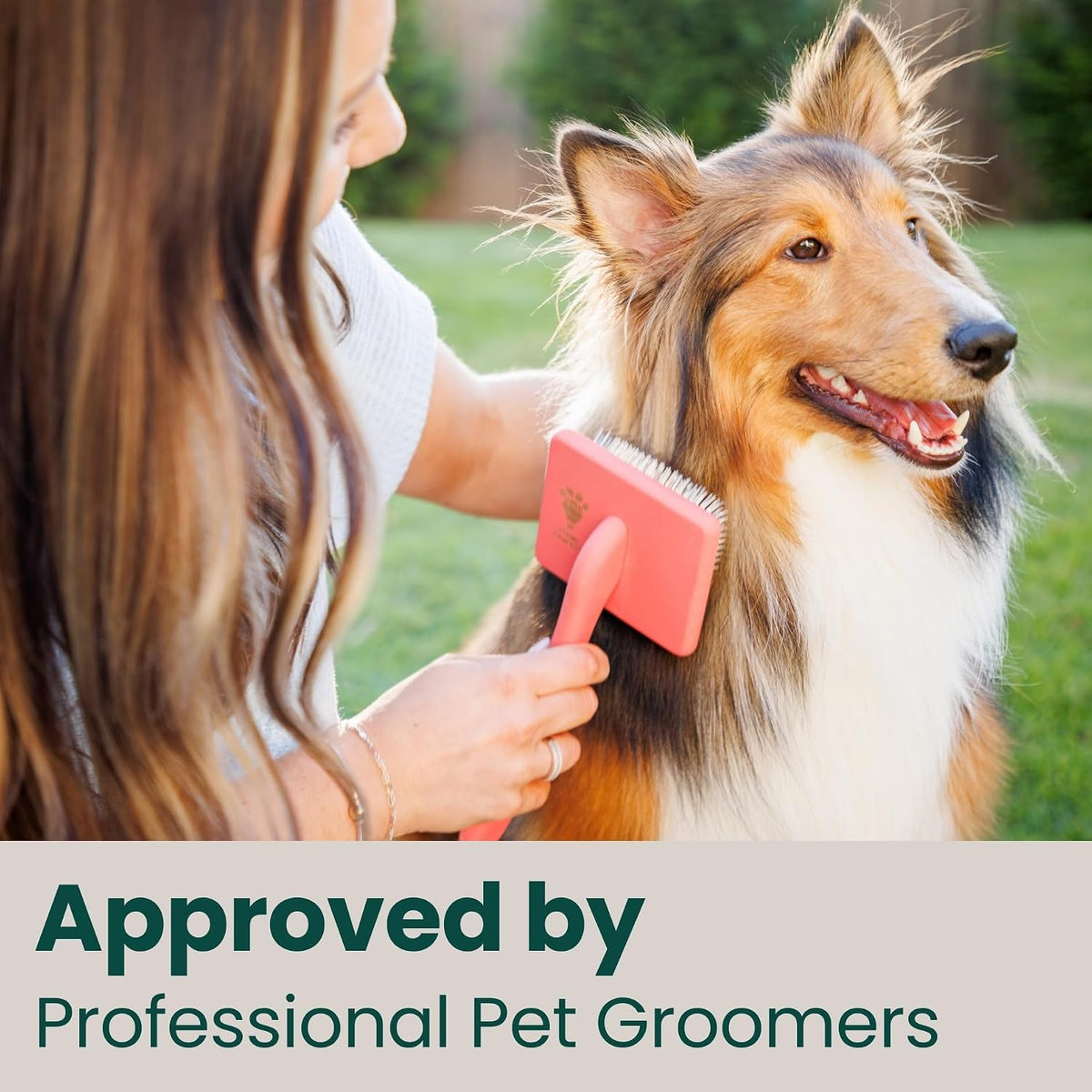 Ergonomic slip resistant handle of the Flying Pawfect coral large slicker brush