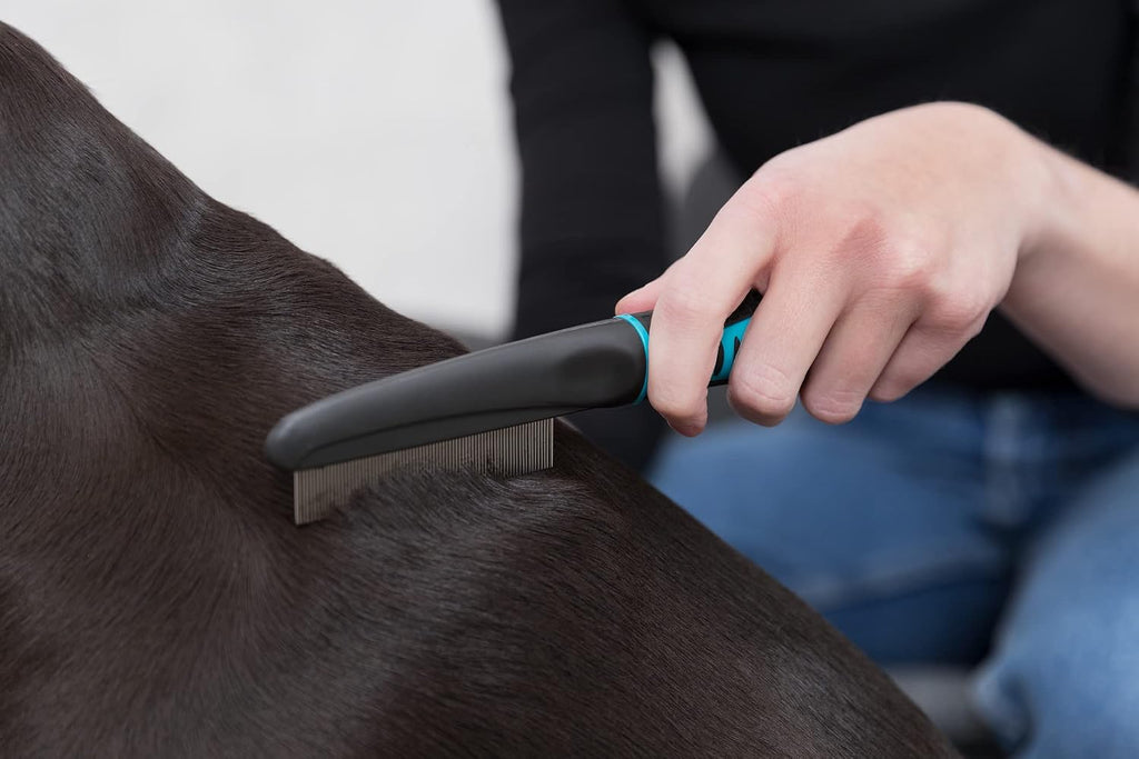 Trixie branding on pet grooming flea comb handle
