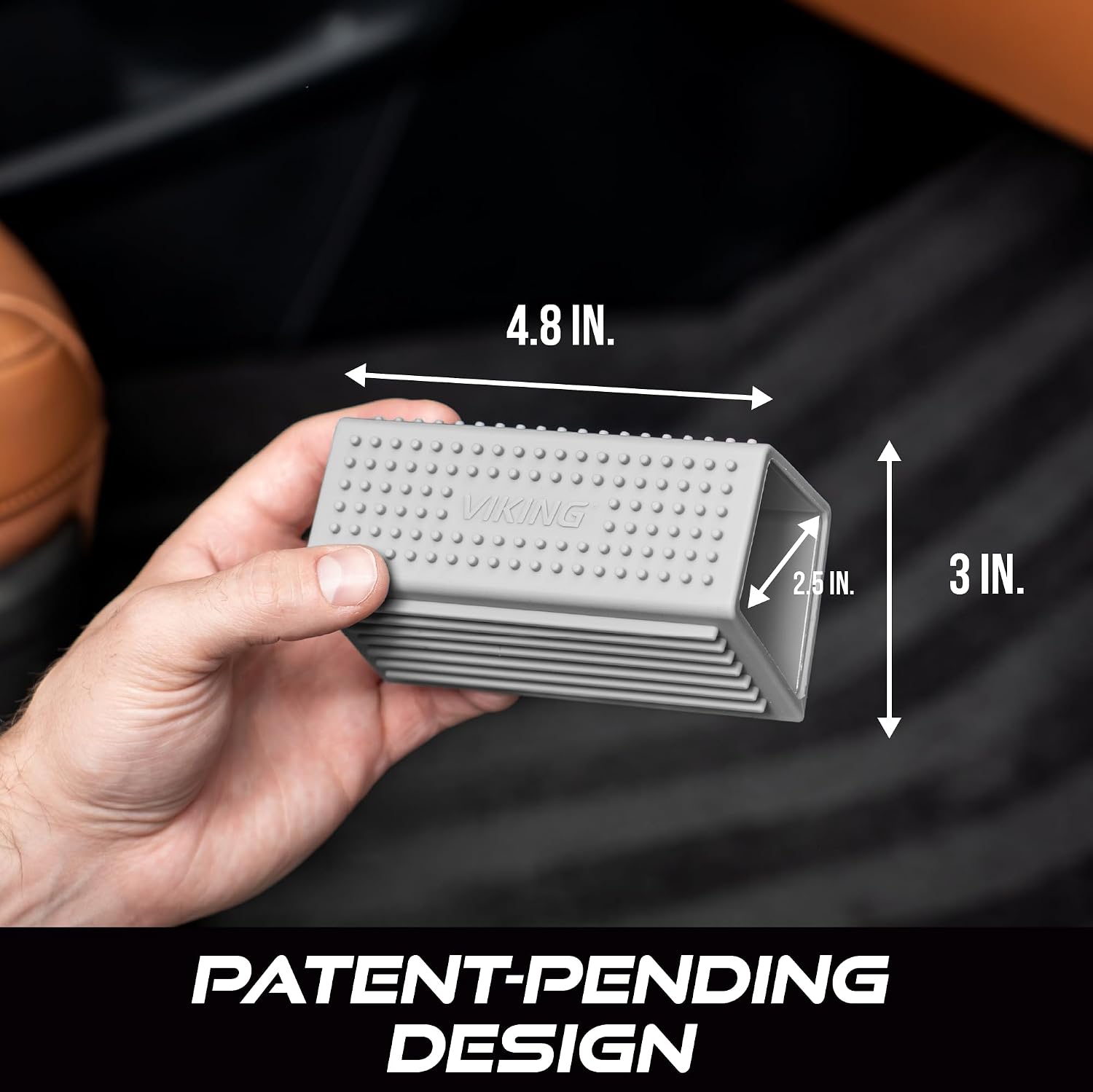 Viking pet hair remover tool next to car floor mat