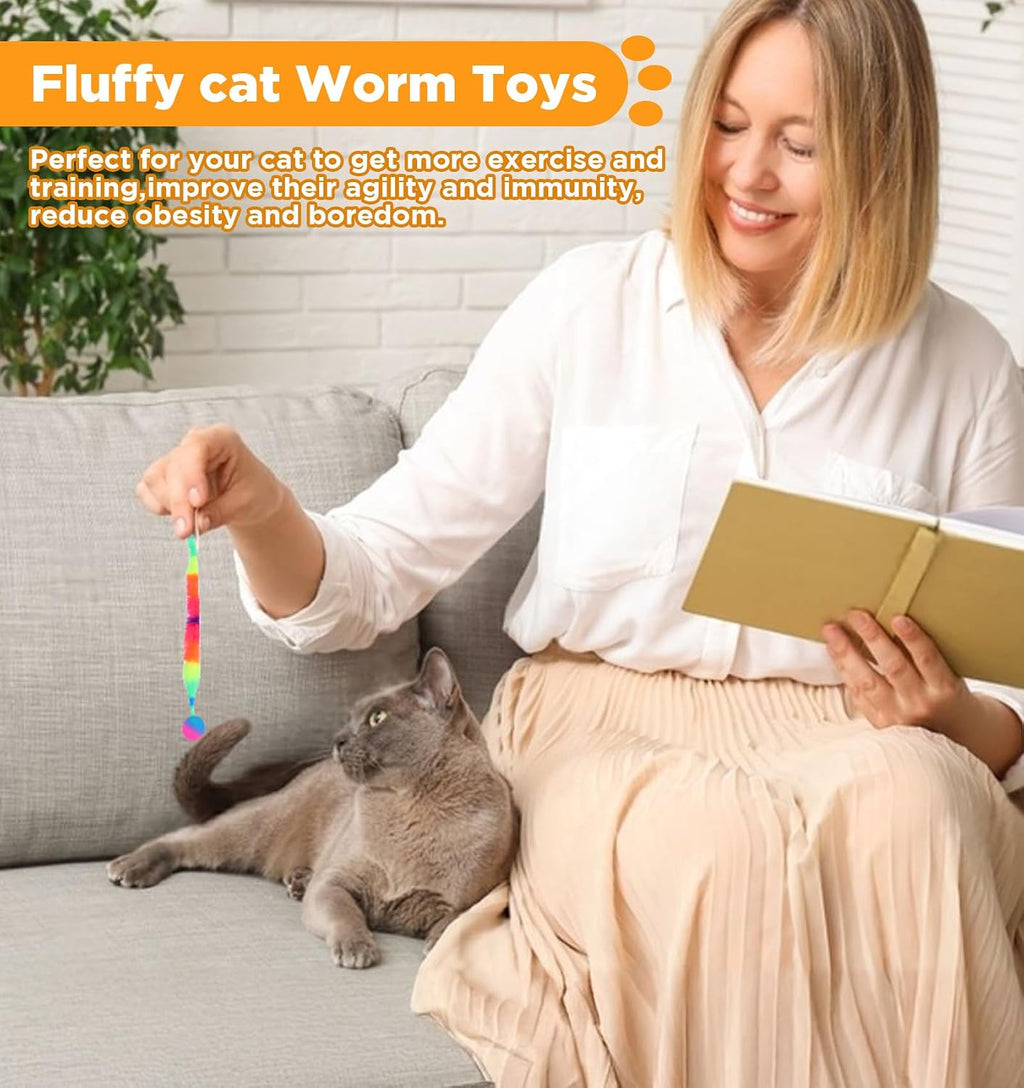 Cat batting a colorful magic worm bouncy ball on floor
