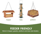 Close up of shell free bird seed mix in a wooden bird feeder