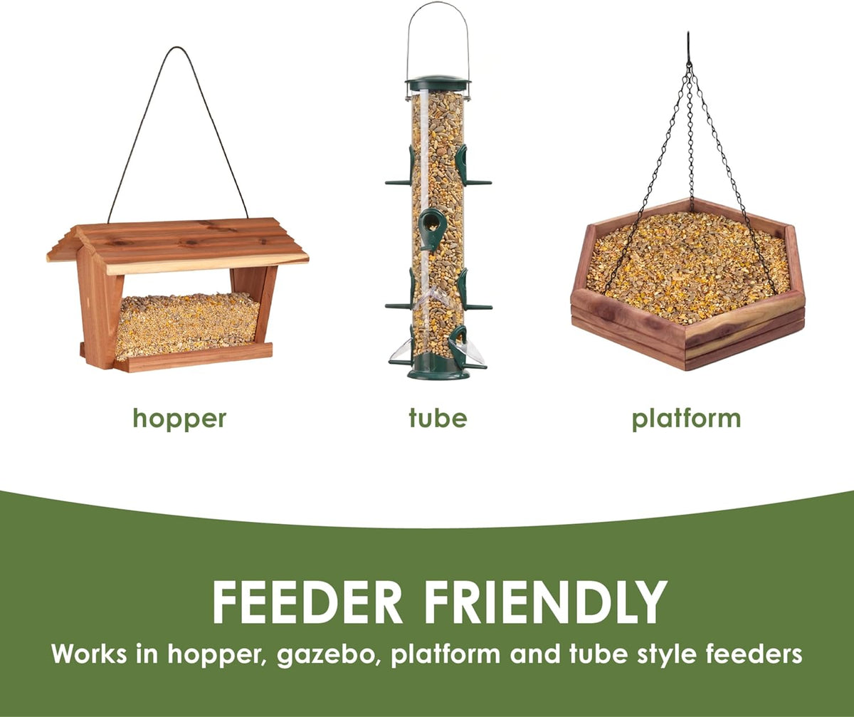 Close up of shell free bird seed mix in a wooden bird feeder