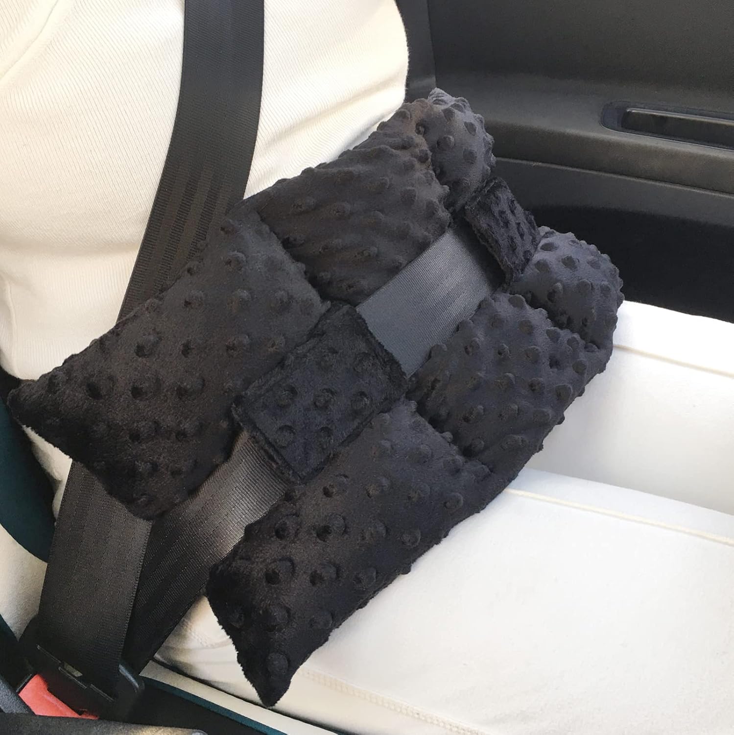 D. Cozy ostomy seat belt pillow black front view showing textured minky dot fabric