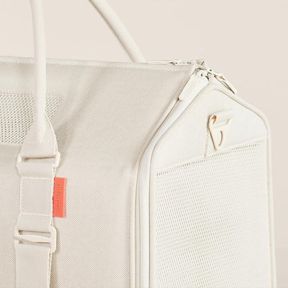 Premium soft sided designer cat carrier with breathable mesh windows.