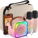 LIOEM mini karaoke machine for kids front view showing pink Bluetooth speaker and two wireless microphones