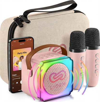 LIOEM mini karaoke machine for kids front view showing pink Bluetooth speaker and two wireless microphones