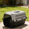 Petmate plastic pet crate front view showing the secure metal wire door.